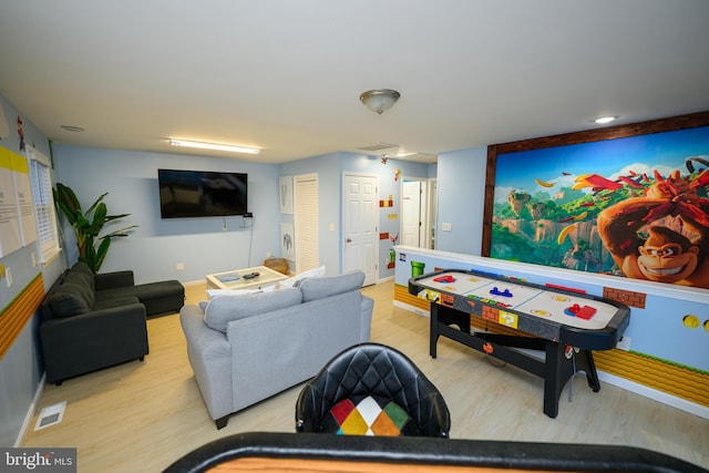 playroom with wood finished floors and visible vents