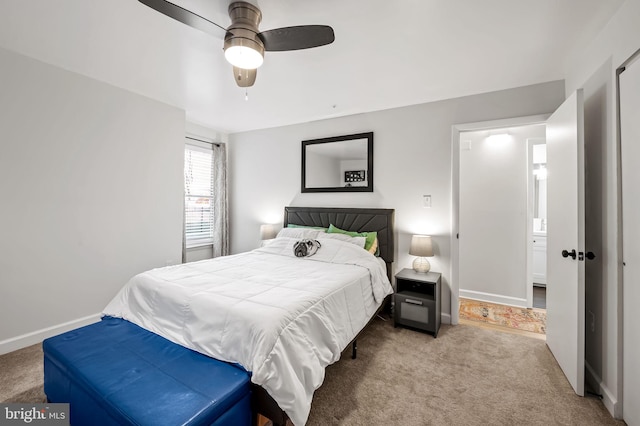 carpeted bedroom featuring a ceiling fan and baseboards