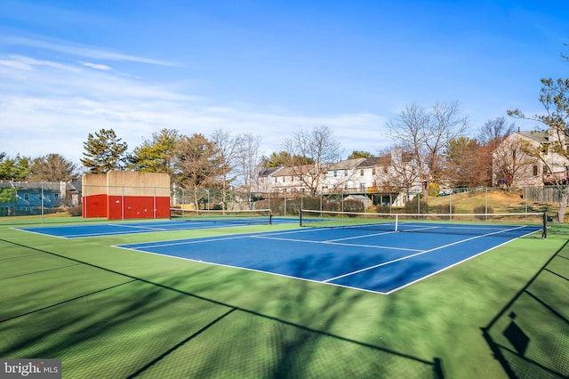 view of sport court with fence