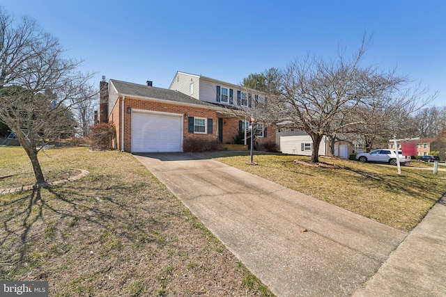 view of front of property featuring a front yard, driveway, an attached garage, a chimney, and brick siding