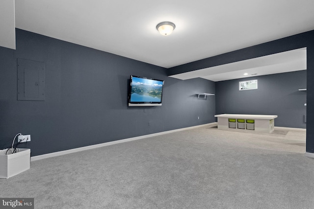 interior space with electric panel, baseboards, and carpet floors