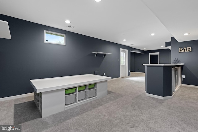 rec room featuring visible vents, recessed lighting, a bar, and light carpet
