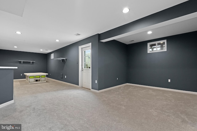 below grade area featuring recessed lighting, baseboards, and carpet floors