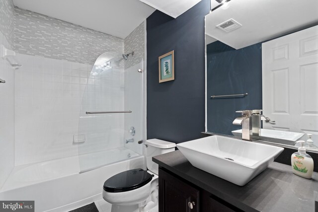 full bathroom with toilet, vanity, visible vents, and  shower combination