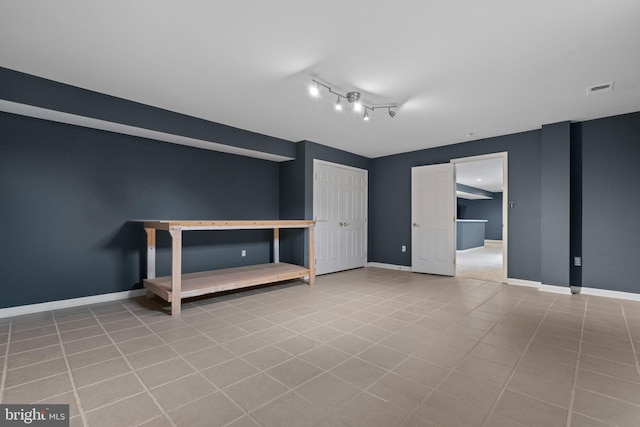 unfurnished bedroom with visible vents, baseboards, and tile patterned flooring