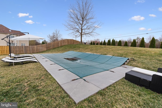 view of pool featuring a fenced in pool, a yard, and fence