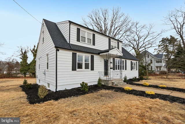 view of front of property with a shingled roof