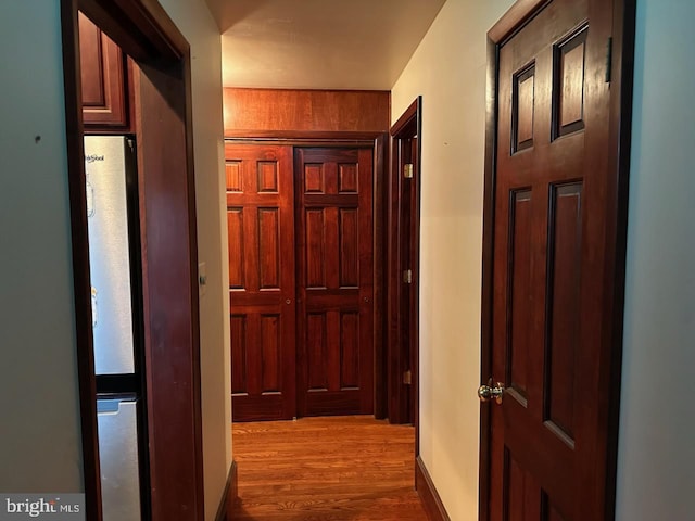 hall featuring wood finished floors