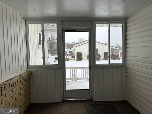 unfurnished sunroom featuring a healthy amount of sunlight