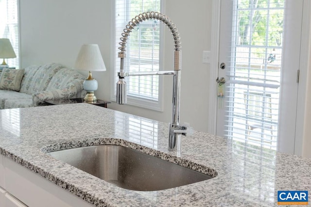 kitchen featuring light stone counters