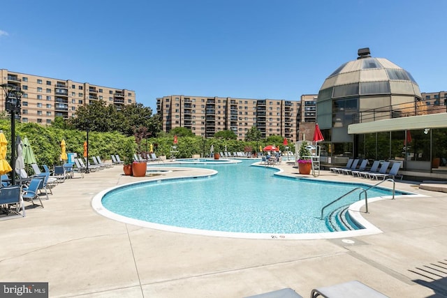 community pool featuring a patio area