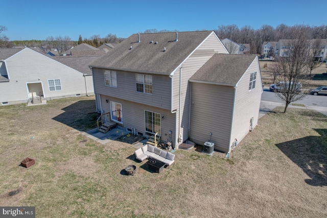 back of property with entry steps, a yard, roof with shingles, and cooling unit