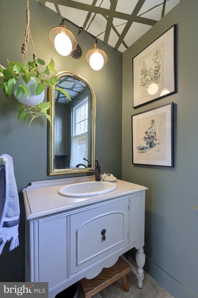 bathroom featuring vanity and baseboards