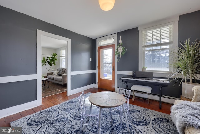 entryway featuring baseboards, baseboard heating, and hardwood / wood-style floors