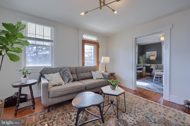 living room with baseboards and hardwood / wood-style floors