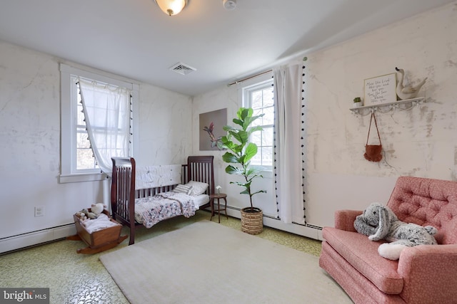 bedroom featuring a baseboard radiator and visible vents