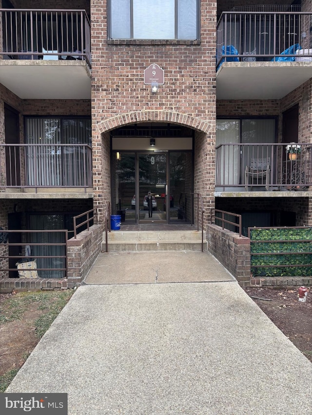 entrance to property with brick siding