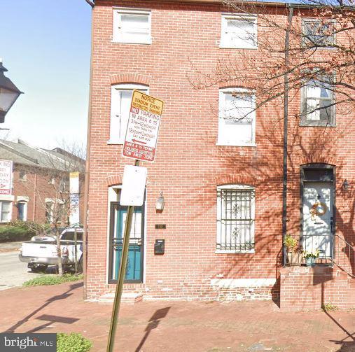 townhome / multi-family property featuring brick siding
