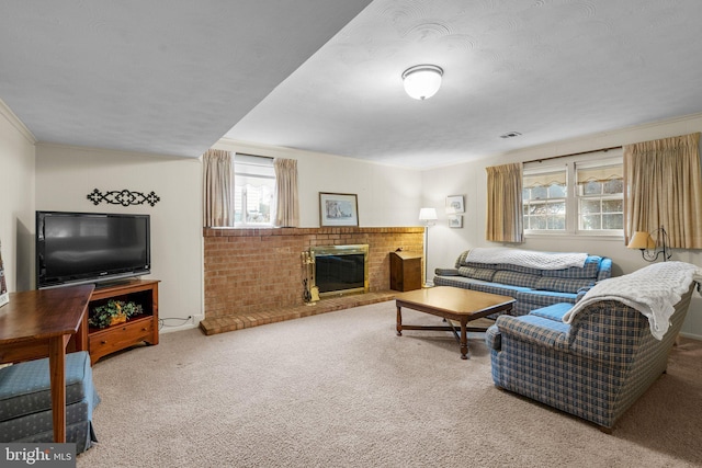 living area with carpet floors, a fireplace, and ornamental molding