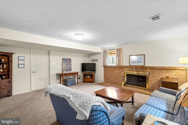 carpeted living room featuring a brick fireplace and visible vents