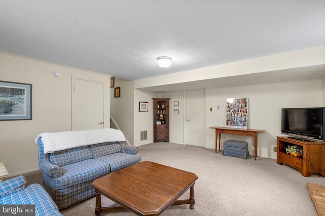 carpeted living room featuring visible vents