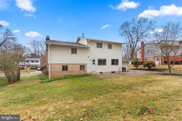 back of property featuring entry steps, a yard, a chimney, and central air condition unit