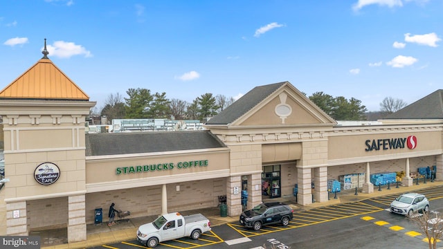 view of property with uncovered parking