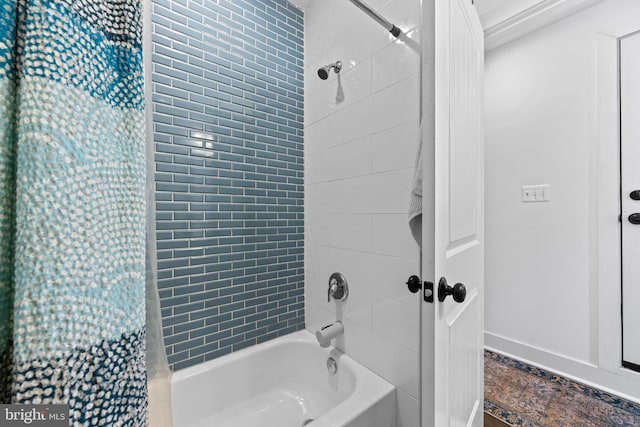 full bathroom with shower / bath combo with shower curtain