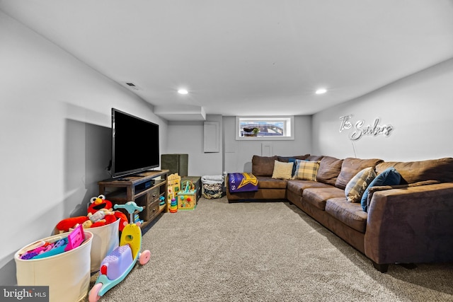 carpeted living area with visible vents and recessed lighting