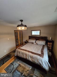 bedroom with wood finished floors