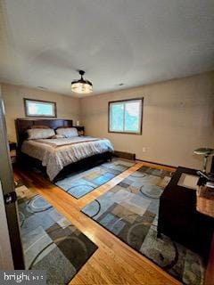 bedroom featuring wood finished floors