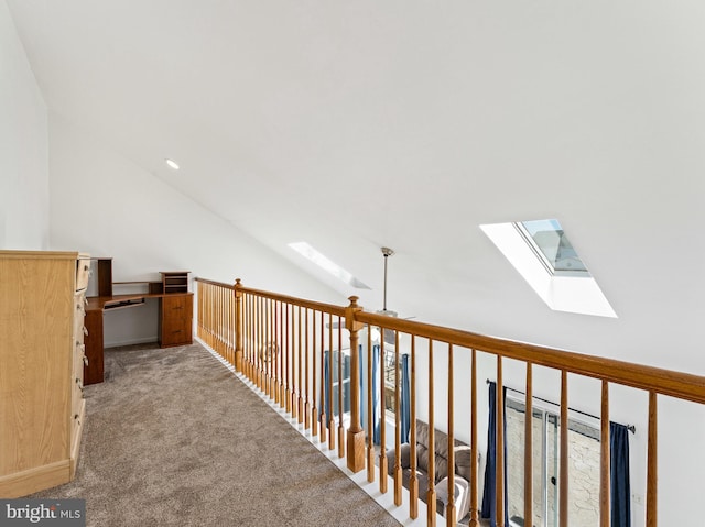 bonus room featuring vaulted ceiling with skylight and carpet