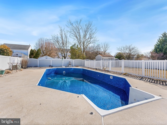 view of pool featuring a patio area, a fenced backyard, and a fenced in pool