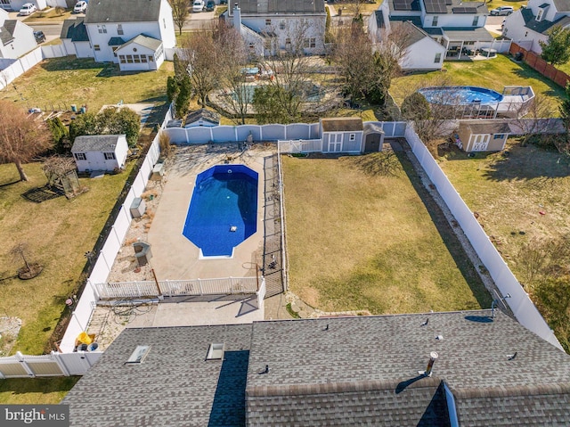 view of pool with a fenced in pool, a residential view, and a fenced backyard