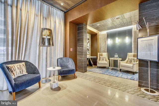 sitting room featuring tile patterned flooring