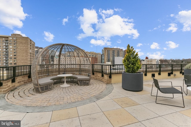 view of patio / terrace featuring a city view