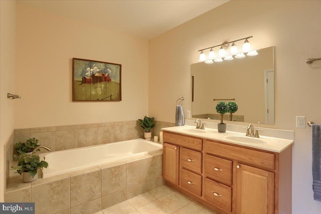 bathroom with a garden tub, double vanity, tile patterned flooring, and a sink