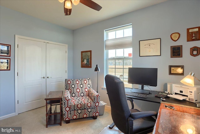 office featuring carpet floors, a ceiling fan, and baseboards