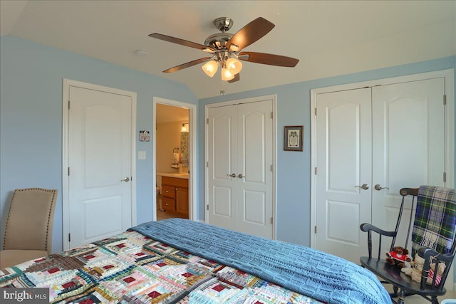 bedroom featuring a ceiling fan and multiple closets