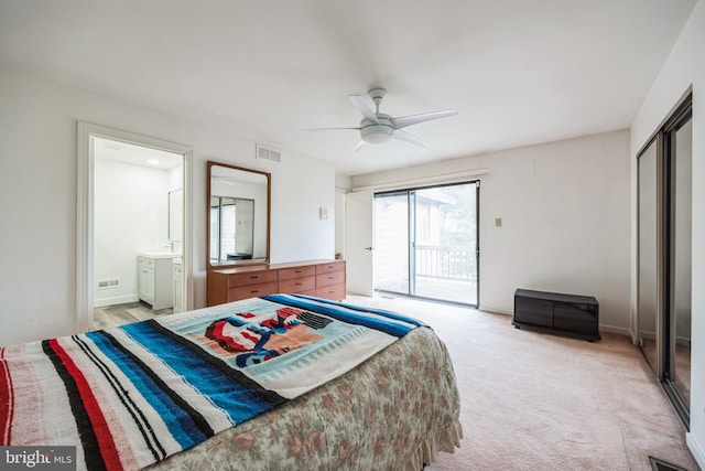 bedroom with light carpet, visible vents, ensuite bathroom, access to exterior, and a closet