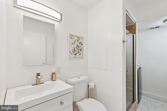 bathroom with visible vents, toilet, a shower stall, vanity, and tile patterned flooring