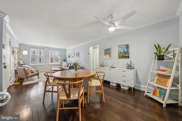 dining space featuring dark wood-style flooring, baseboards, and ornamental molding