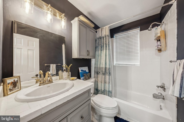 bathroom with shower / bathtub combination with curtain, toilet, and vanity