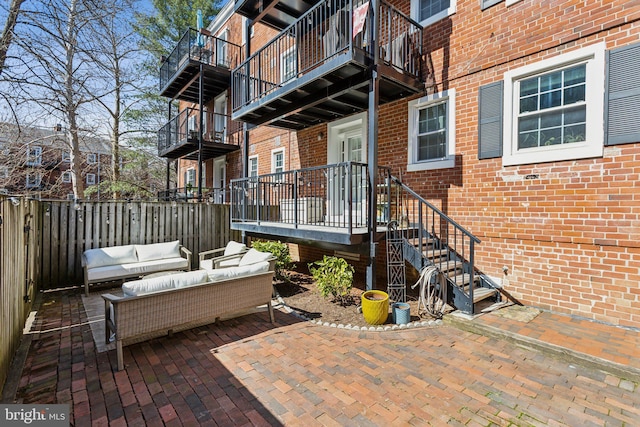 view of patio / terrace with an outdoor hangout area and fence