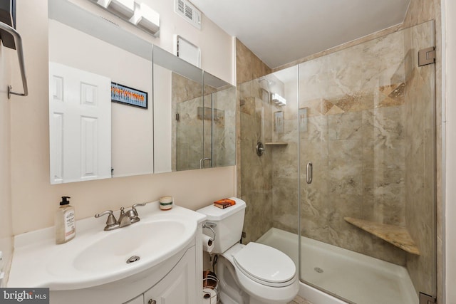 full bath featuring visible vents, a stall shower, toilet, and vanity