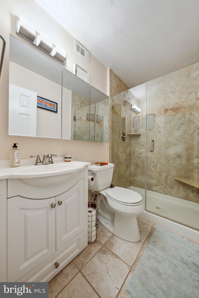 full bath featuring visible vents, a stall shower, toilet, and vanity