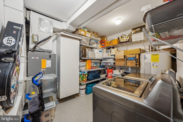 interior space with washer and clothes dryer and electric water heater