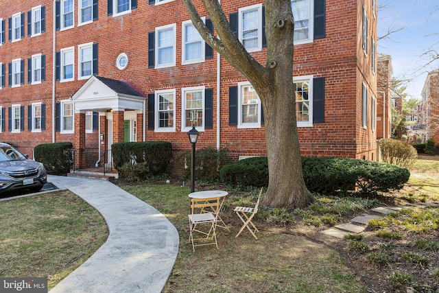 exterior space with brick siding