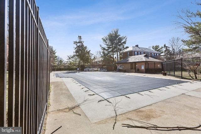 pool featuring a patio and fence