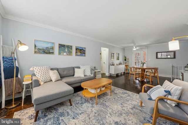 living room featuring a ceiling fan, wood finished floors, baseboards, and ornamental molding